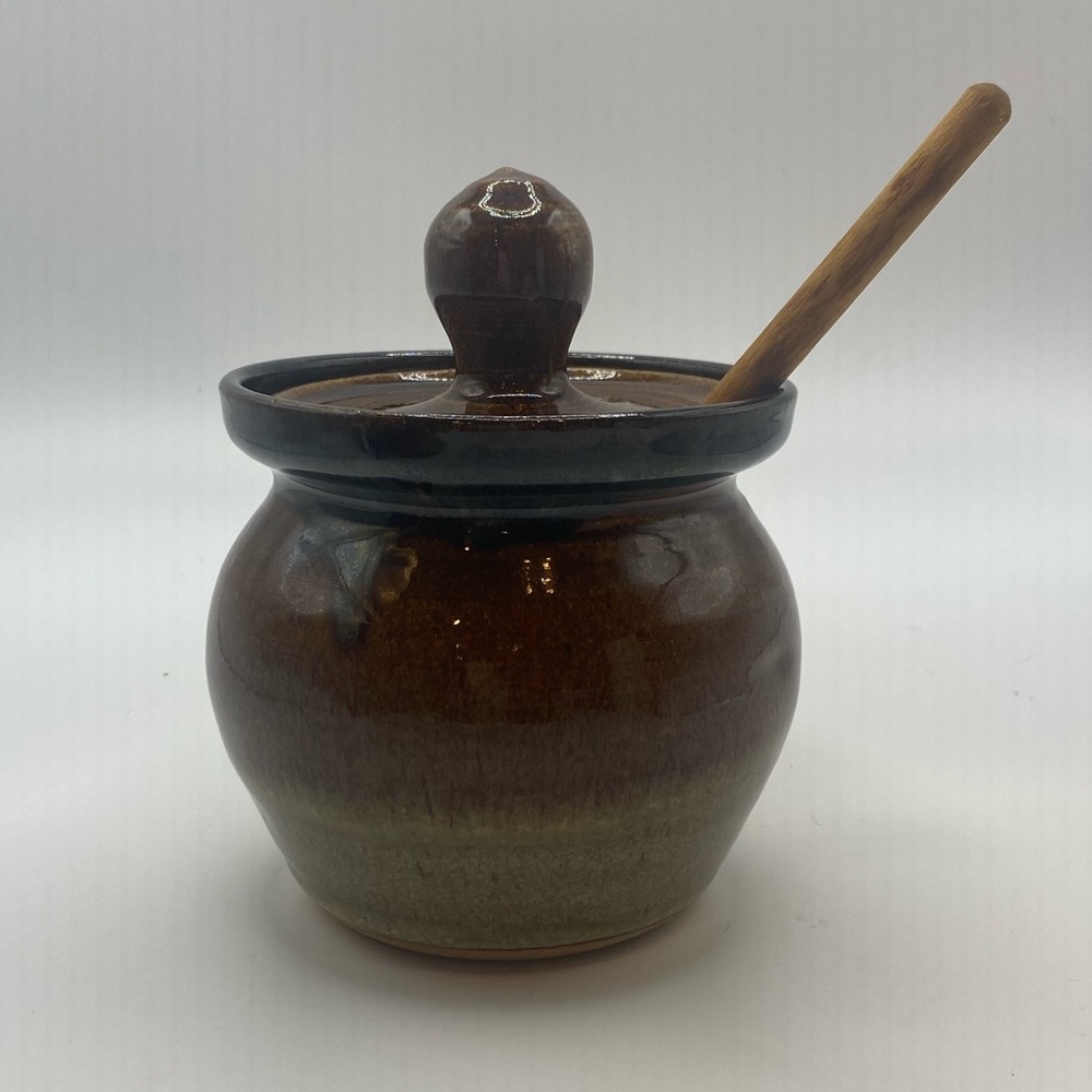 Handmade ceramic honey pot with stick/dipper.